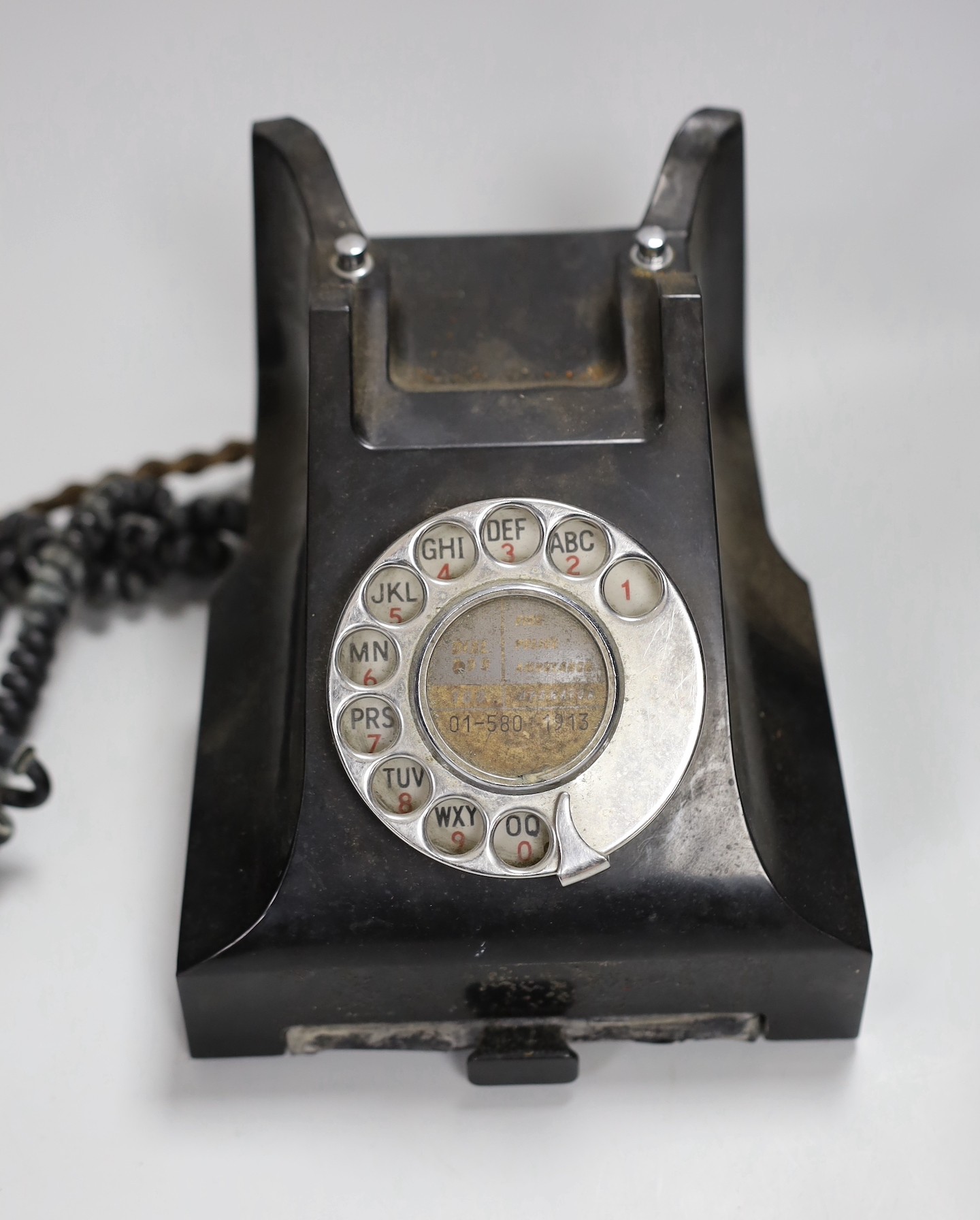 A black Bakelite telephone handset